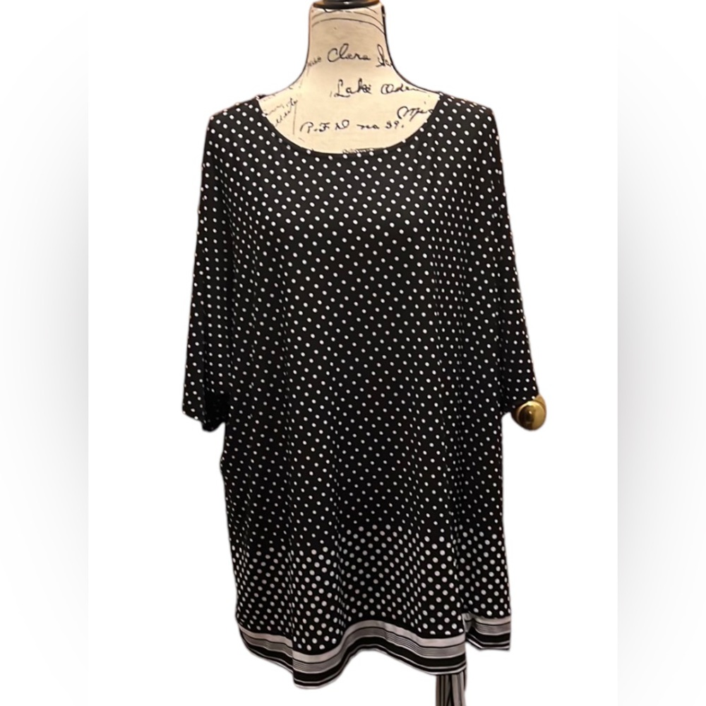 Avenue black and white polka dot top with a striped band on the bottom that ties